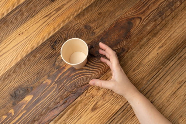 istock Hand Grabs Cup, Hands Reaching Empty Paper Cup, Coffee Mug, Cardboard Teacup, Hot Beverage Mockup 1838553295