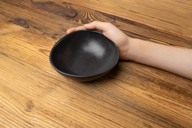 istock Bowl in Hands, Empty Bowl in Arms on Wooden Background, Vintage Kitchen Tableware Mockup 1838553700