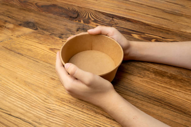 istock Bowl in Hands, Empty Bowl in Arms on Wooden Background, Vintage Kitchen Tableware Mockup 1838553827
