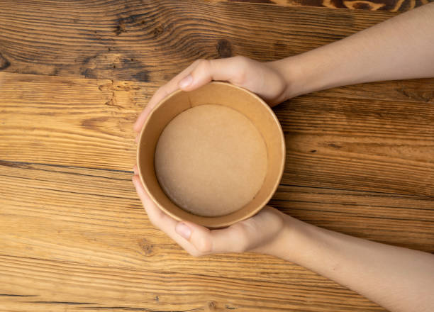 istock Bowl in Hands, Empty Bowl in Arms on Wooden Background, Vintage Kitchen Tableware Mockup 1838553838