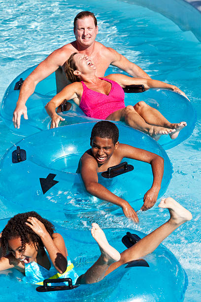 istock People having fun at water park 183855584