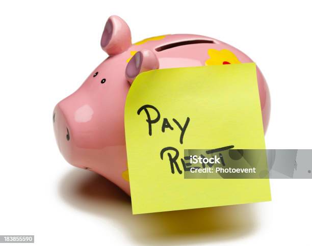 A Pink Piggybank With Pay Rent Written On It Stock Photo - Download Image Now - Adhesive Note, Coin Bank, Concepts