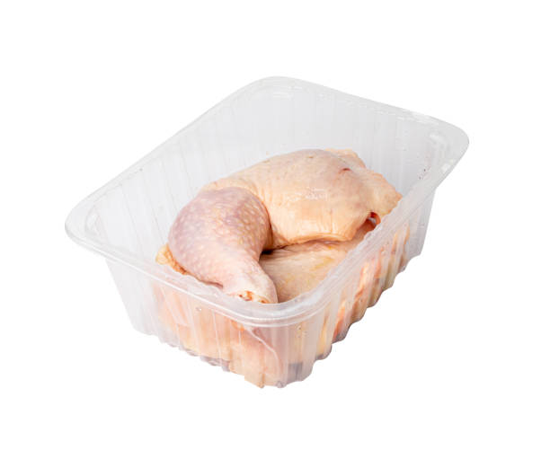 istock Raw Chicken Legs in a Plastic Container Isolated, Fresh Chicken Quarter on White Background 1838555931