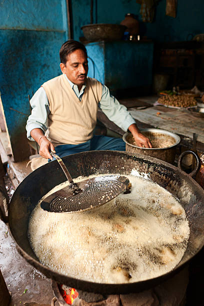 istock Indian street vendor preparing food 183855732