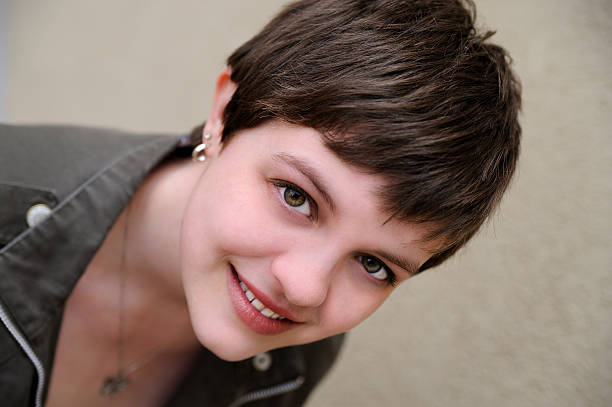 young woman with short hair stock photo