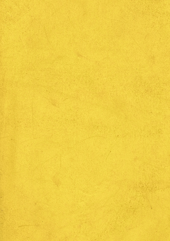 A grunge background of dirty old yellow paper