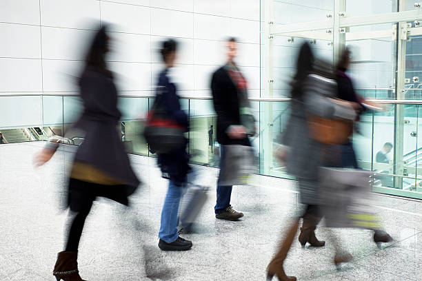 istock People Walking in Modern Bright Interior With Glass Elevator 183856645