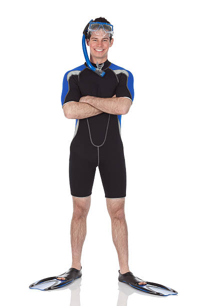 Man in scuba gear standing with arms crossed Man in scuba gear standing with arms crossedhttp://www.twodozendesign.info/i/1.png diving flippers stock pictures, royalty-free photos & images