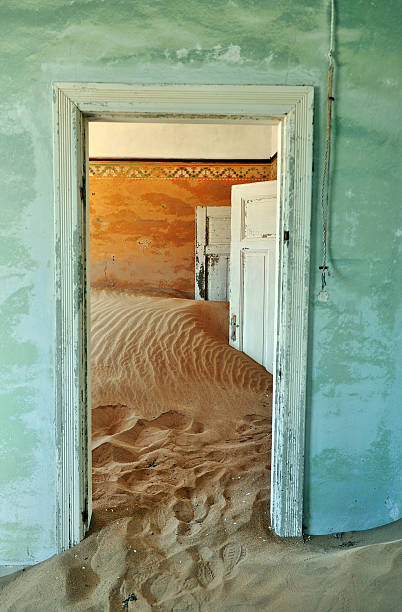 House in Kolmanskop, a ghost town near Luderitz,Namibia Interior of a house in Kolmanskop,a ghost town in the restricted diamond area near Luderitz,Namibia. kolmanskop namibia stock pictures, royalty-free photos & images