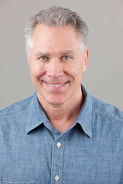 istock Smiling middle age man with blue denim shirt 183858618