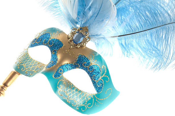 Turquoise blue and gold mask.  Horizontal studio shot on white.