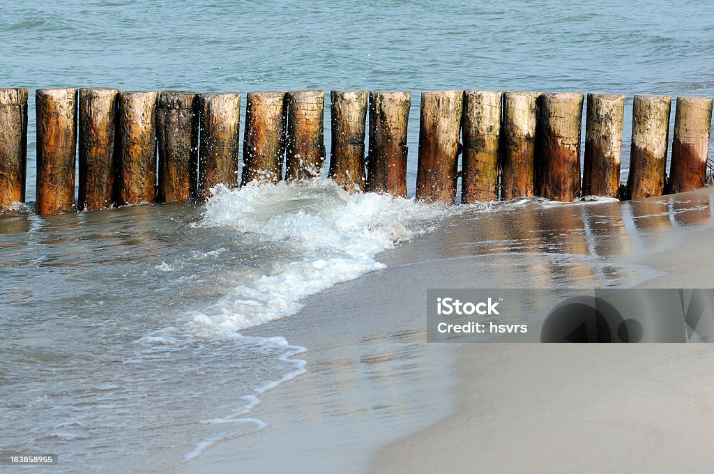 groyne with waves Baltic Sea beach of Darss peninsulas (Germany) groyne (groin) and waves at Baltic Sea beach of Darss peninsulas (Germany). typical wood wave breaker Backgrounds Stock Photo
