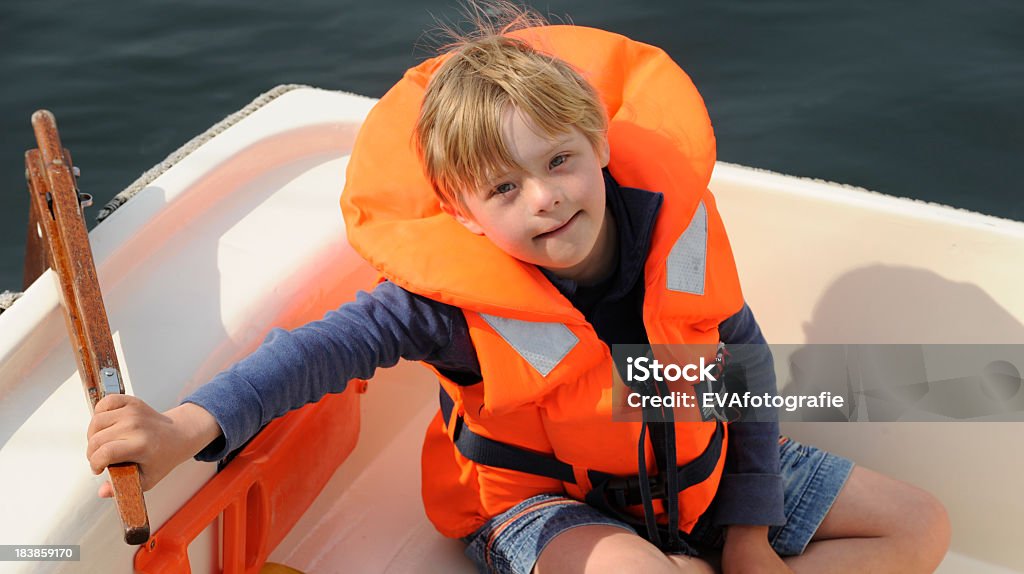 Boy with down syndrome in small sailingvessel Eight year old boy with down syndrome sailing for the first time alone.http://www.istockphoto.com/file_thumbview_approve.php?size=1&id=17947512 Persons with Disabilities Stock Photo