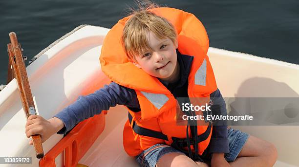 Boy With Down Syndrome In Small Sailingvessel Stock Photo - Download Image Now - Persons with Disabilities, Sailing, 8-9 Years