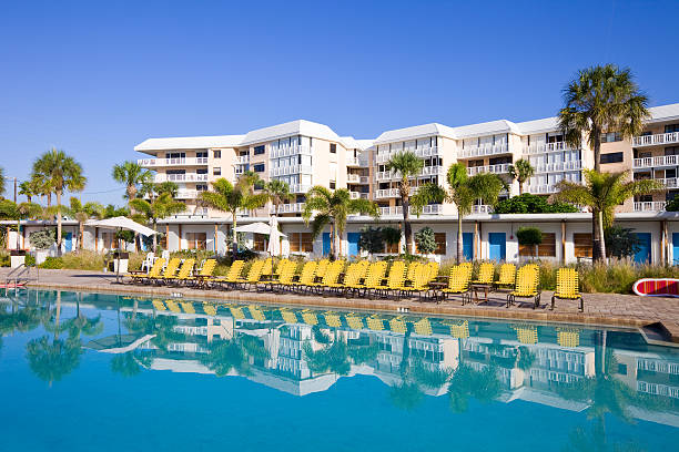 istock Tropical Resort and Pool with Lounge Chairs 183859590