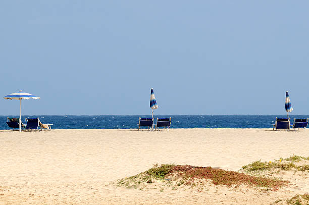 istock Beach chairs and umbrellas in front of blue Atlantic Ocean. 183859716