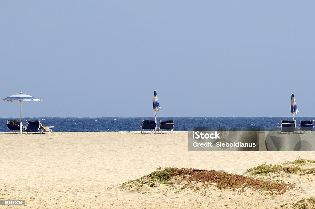 Beach chairs and umbrellas in front of blue Atlantic Ocean. Beach chairs and umbrellas in front of blue Atlantic Ocean.related: Atlantic Ocean Stock Photo