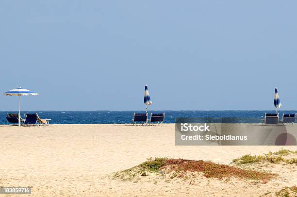 Beach Chairs And Umbrellas In Front Of Blue Atlantic Ocean Stock Photo - Download Image Now