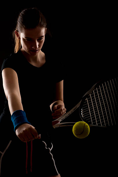 istock Female tennis player hitting the ball 183859936