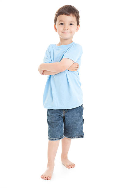 Young Boy Standing With Arms Crossed, White Background