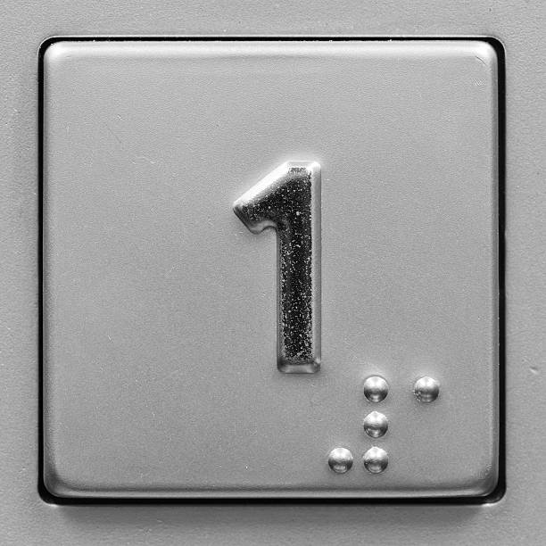 istock Close-up of metal push button in elevator for first floor 183860237