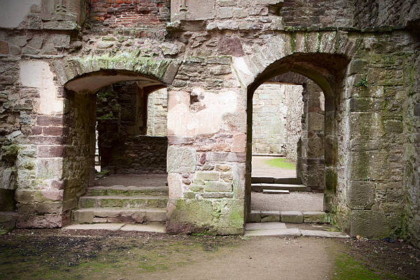 Interior doorways of the ruins of the magnificent 15th century Raglan Castle, in Wales. Once an aristocratic estate, the Raglan Castle was a casualty of the English Civil War in the 17th century, and is now a popular tourist attraction.