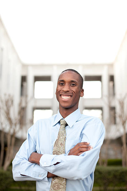 istock Confident businessman with building in the background 183860652
