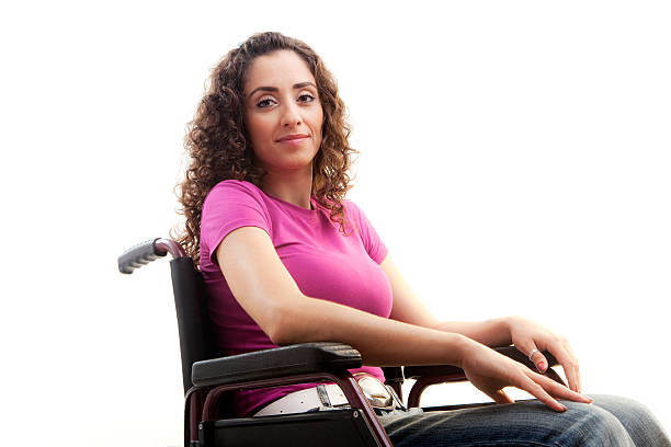 A happy child sitting in a wheelchair.
