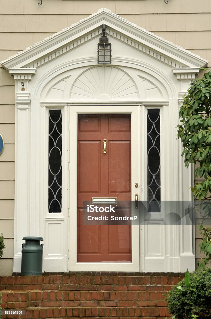 Orange Door Front door painted orange. FOR MORE HOUSES AND DOORS (CLICKHERE) Architecture Stock Photo