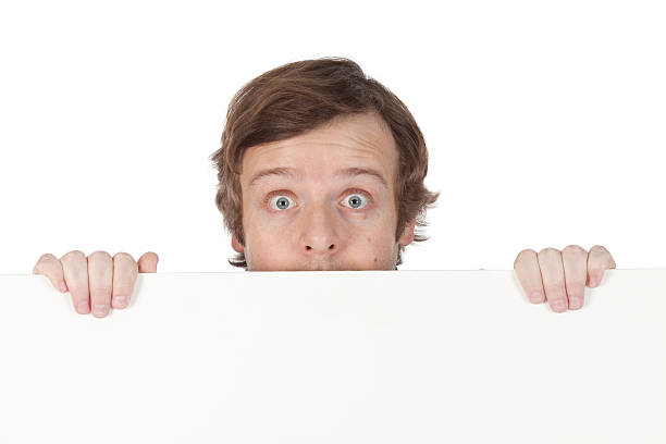 istock Businessman peeking over a placard 183861840