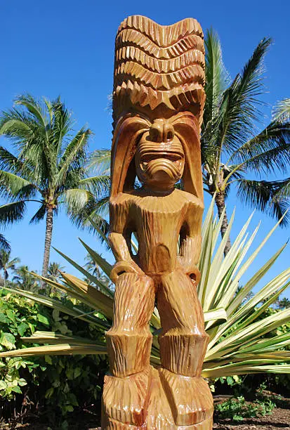 Carved wooden staue of Tiki or Hawaiian God of humanoid form.