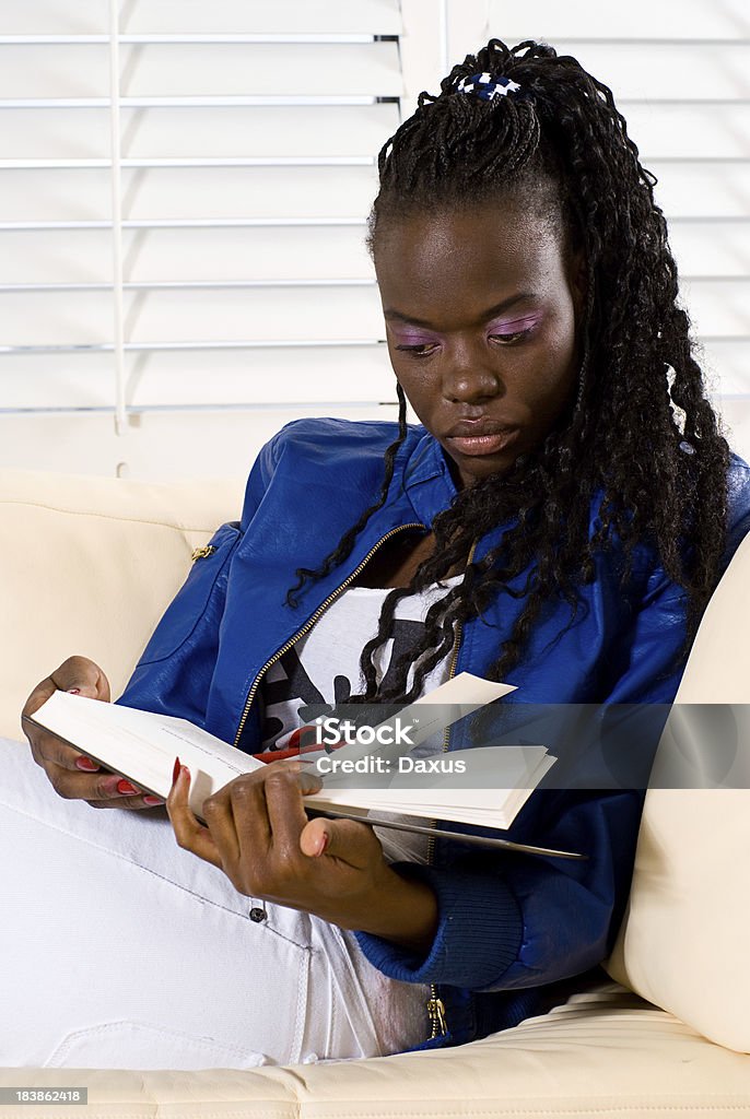 Black Woman Reading Black Woman Reading on a Couch - Shot at TO2010 Minilypse 20-29 Years Stock Photo
