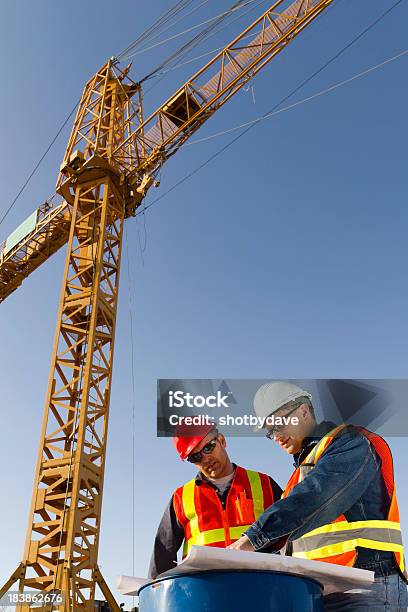 Crane Meeting Stock Photo - Download Image Now - Construction Site, Working Class, Blueprint