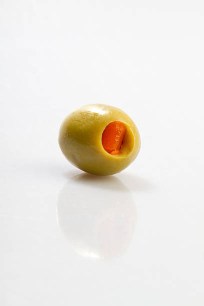 Green Olive Green olive with pimento and reflection olive tree cut out stock pictures, royalty-free photos & images