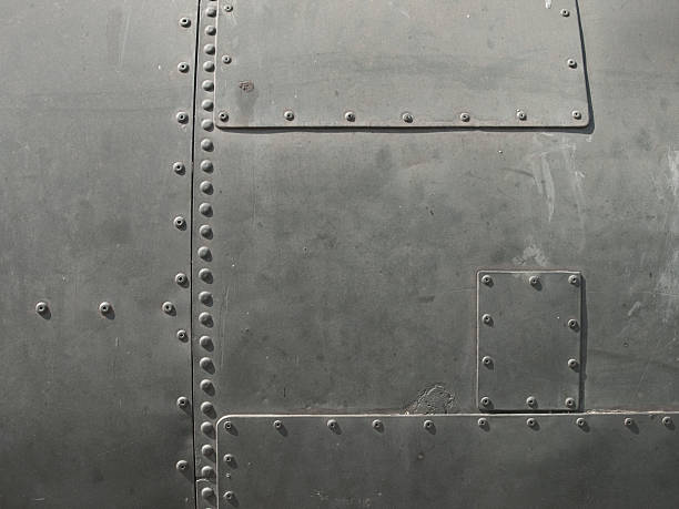 Close-up of military detail in a dark gray color Detail shot of old military equipment rivet stock pictures, royalty-free photos & images