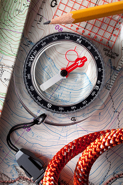 bússola sobre topographic maps. - orienteering planning mountain climbing compass imagens e fotografias de stock