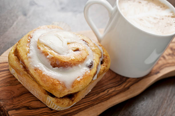 Cinnamon Bun with mug of Cappuccino