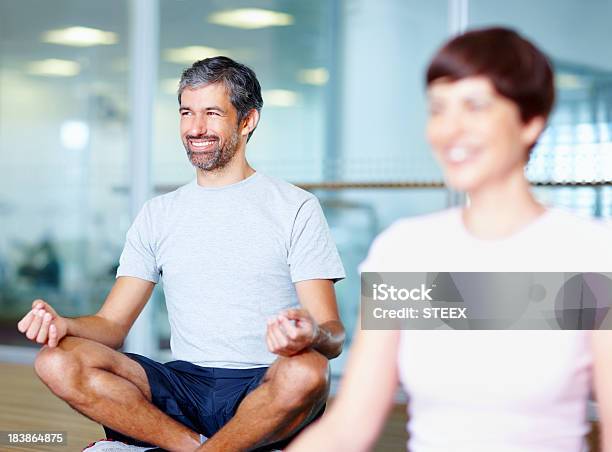 Man Practicing Yoga In Lotus Position Stock Photo - Download Image Now - 30-39 Years, 40-49 Years, Adult