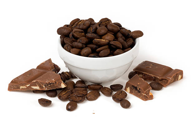 dish of coffee beans and chocolate stock photo