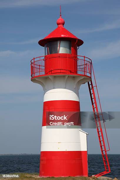 Lighthouse In Red And White At Grisetaa Odde Stock Photo - Download Image Now - Bay of Water, Beacon, Blue
