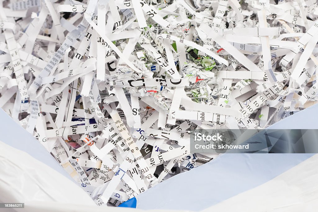 Shredded Paper in Garbage Bag A garbage bag full of shredded documents. Bag Stock Photo