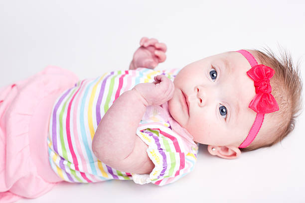 istock Three Month Old Baby Girl Looking at Camera 183865219