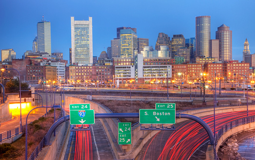 Traffic leading into downtown Boston, Massachusetts during rush hour. Boston is the largest city in New England, the capital of the state of Massachusetts. Boston is known for its central role in American history,world-class educational institutions, cultural facilities, and champion sports 