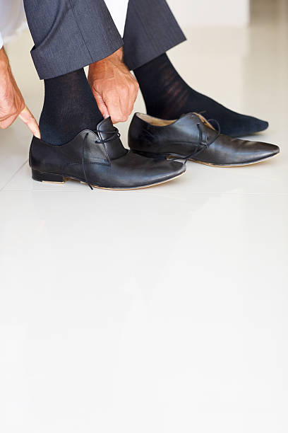 istock Business man wearing shoes 183865562