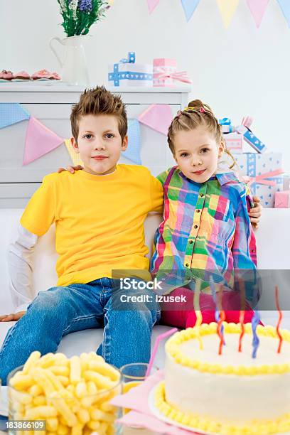 Siblings At A Birthday Party Stock Photo - Download Image Now - 6-7 Years, 8-9 Years, Birthday