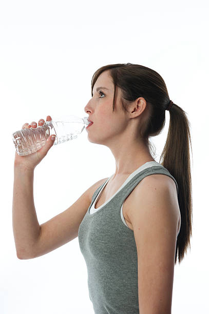istock young woman drinking water 183866290