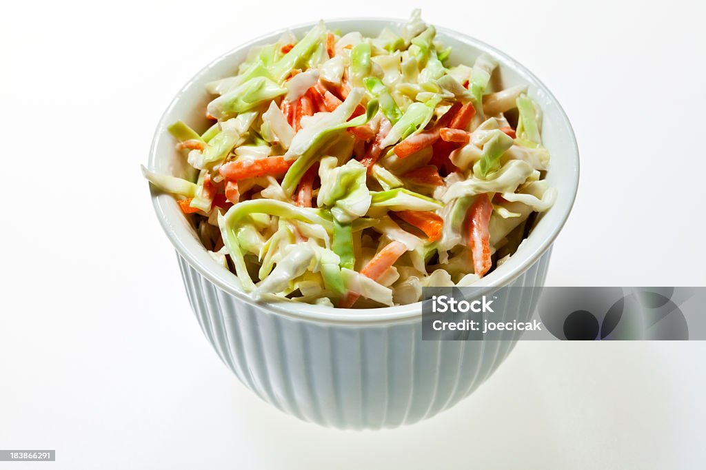 A bowl full of coleslaw on a white background Small ceramic bowl filled with coleslaw. Coleslaw Stock Photo