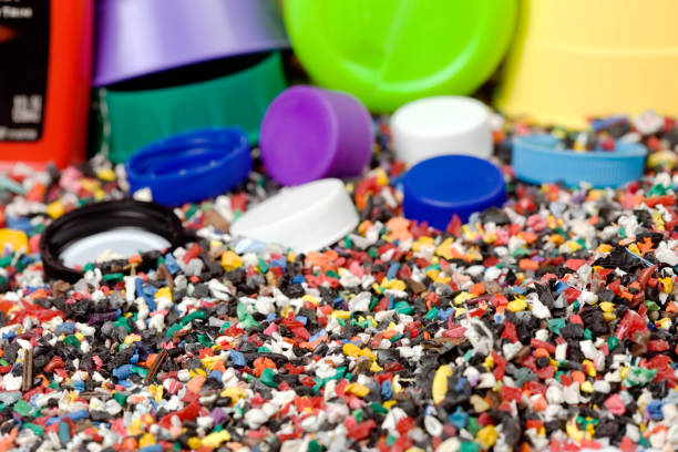 Plastic bottle colored screw caps for recycle waste on white background, container water lid.