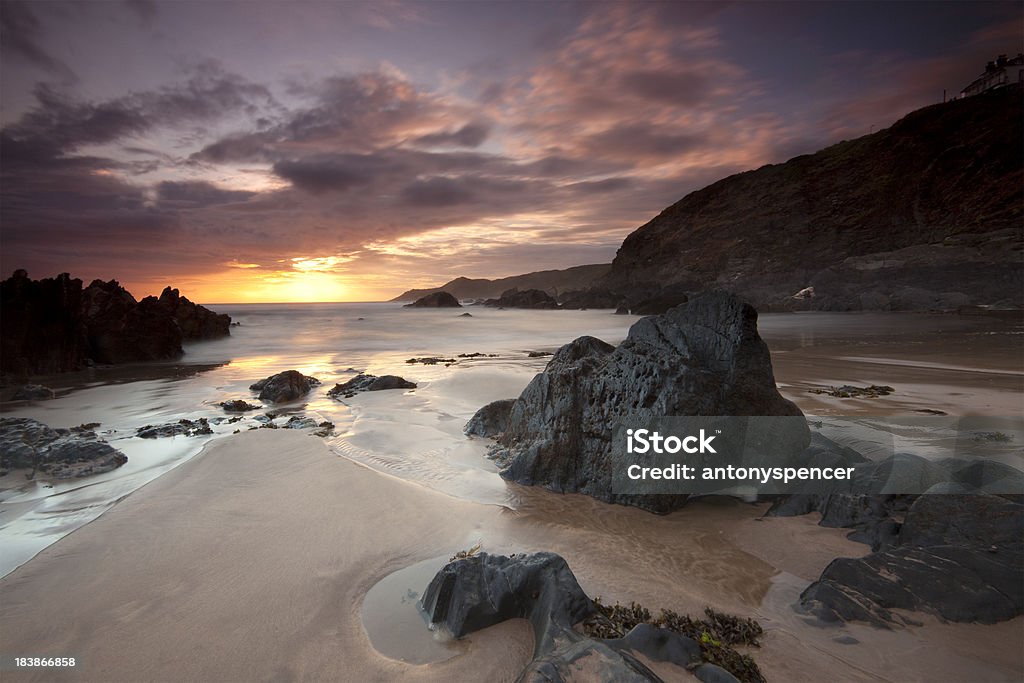 Woolacombe Sunset A dramatic sunset at woolacombe on the Atlantic North Devon Coast. Beach Stock Photo