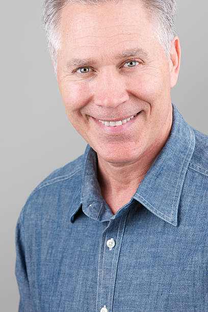 istock Smiling middle age man with blue denim shirt 183867835